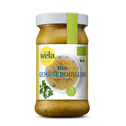 Wela Bio Gemüsebouillon Feine Paste - Glas mit Suppenpaste, gelb-weißem Vorderseitenetikett, grüne Banderole, Motiv einer Brühe mit Kräutern