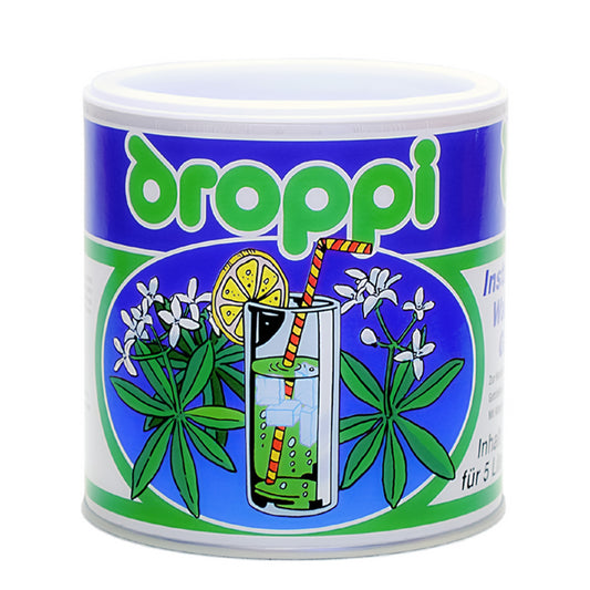 Wela Droppi Waldmeister Geschmack - eine Dose mit bunten Illustrationen auf dem Etikett
