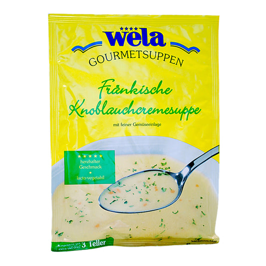 Ein gelber Suppenbeutel mit grüner Aufschrift und Suppe als Motiv.
