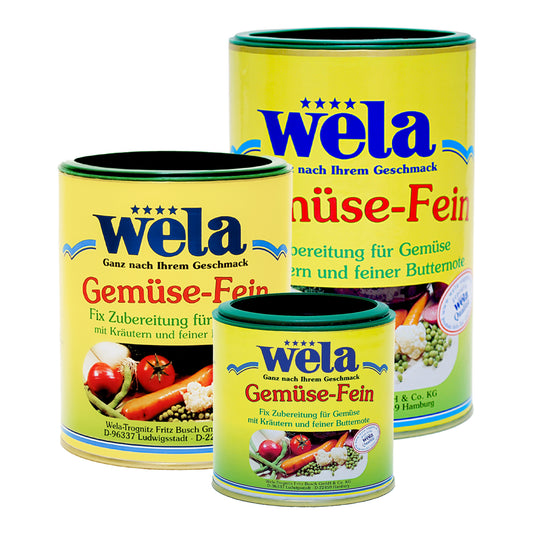 Wela Gemüse-Fein – drei unterschiedlich große Dosen mit grün-gelben Etiketten und Gemüseabbildung.
