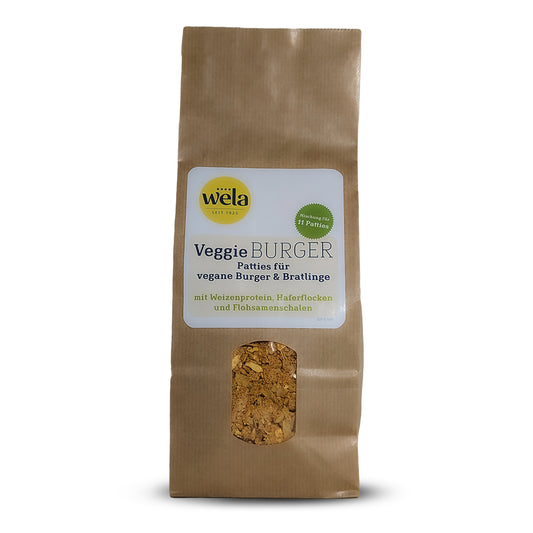 Wela Veggie Burger – brauner Beutel mit Sichtfenster und weißem Etikett mit grüner und blauer Aufschrift.